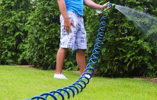 Application of 15M Coil Hose for Plant Watering, Patio Decking, and Cleaning
